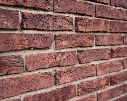 Brick wall. Texture of red brick with white filling